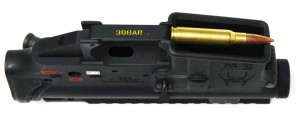 Bottom view of a Spikes Tactical AR15 Lower Receiver with a .308 Winchester Cartridge laying across the Magazine Well - 308 AR15 , AR15 vs AR-10 308AR AR308
